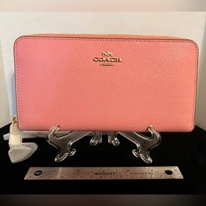 NWT Coach Pink Zip Around Wristlet